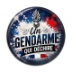 Cabochon Résine - un gendarme qui déchire